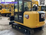 2024 Caterpillar 305.5E2 mini excavator, rear three-quarter view