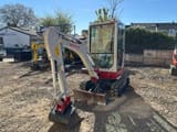 2023 Takeuchi TB216 V0 mini excavator, front three-quarter view