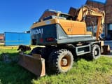 2010 Hyundai R140W-9 wheel excavator, rear three-quarter view