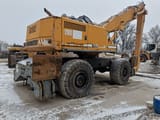2000 Liebherr A 932 Litronic material handler, rear three-quarter view