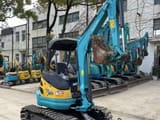 2024 Kubota U25 mini excavator, front three-quarter view