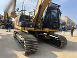 2020 Caterpillar 323D2L crawler excavator, front three-quarter view