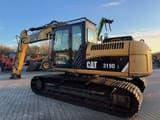2010 Caterpillar 319DL crawler excavator, side view