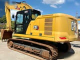 2023 Caterpillar 320GC crawler excavator, rear three-quarter view