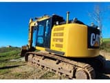 2014 Caterpillar 320EL crawler excavator, rear three-quarter view