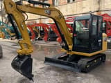 2023 Caterpillar 305.5E2 mini excavator, side view