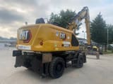 2024 Caterpillar MH3022-07D material handler, rear three-quarter view