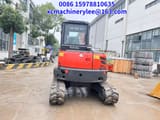 2023 Kubota KX057-4 mini excavator, rear view