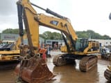 2010 Caterpillar 385CL crawler excavator, front three-quarter view