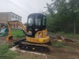 2021 Caterpillar 303.5E mini excavator, rear three-quarter view