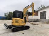 2022 Caterpillar 303.5E mini excavator, rear three-quarter view