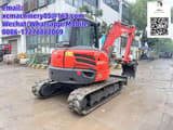 2024 Kubota KX057-4 mini excavator, rear three-quarter view