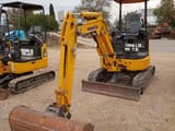 2022 Komatsu PC24MR-5 mini excavator, front three-quarter view