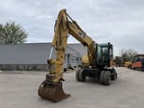 2006 Caterpillar M313C wheel excavator, front three-quarter view