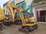2014 Komatsu PC10MR crawler excavator, front three-quarter view