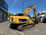 2011 Caterpillar 324D crawler excavator, rear three-quarter view
