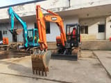 2023 Doosan DH55 mini excavator, front three-quarter view