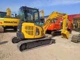 2024 Komatsu PC-55MR mini excavator, rear three-quarter view