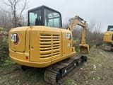 Caterpillar 306 mini excavator, rear three-quarter view