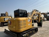 2023 Caterpillar 305.5E2 mini excavator rear three-quarter view