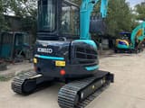2023 Kobelco SK55SR mini excavator, rear three-quarter view