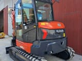 2022 Kubota KX060-5 mini excavator, front three-quarter view