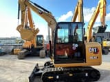 2022 Caterpillar 305.5E2 mini excavator, side profile view