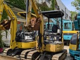 2022 Caterpillar 302C mini excavator, front three-quarter view