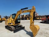 2022 Caterpillar 305.5 mini excavator, front three-quarter view