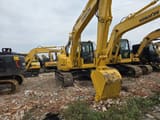 2023 Komatsu PC138US crawler excavator, front three-quarter view