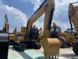 2023 Caterpillar 320GC crawler excavator, front three-quarter view