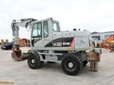 2009 Caterpillar M313D wheel excavator, side view