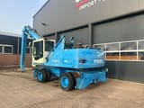 2001 Fuchs MHL340 material handler, rear three-quarter view