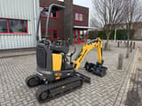 2025 New Holland E12D mini excavator, rear three-quarter view