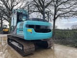 2023 Kobelco SK130LC-11 crawler excavator, rear three-quarter view