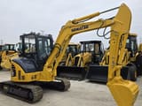 2023 Komatsu PC-55MR mini excavator, rear three-quarter view