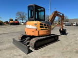 2010 CASE CX55B mini excavator, rear three-quarter view