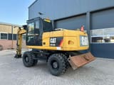 2011 Caterpillar M315D wheel excavator, rear three-quarter view