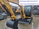 2023 Caterpillar 305.5E2 crawler excavator, front three-quarter view