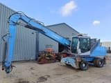 2010 Fuchs MHL331 material handler, side view