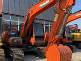Doosan DX140LC-9C crawler excavator, front three-quarter view