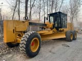 2025 Caterpillar 140K motor grader, side view