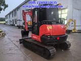 2024 Kubota KX057-4 mini excavator, rear three-quarter view
