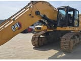 2021 Caterpillar 395-07 crawler excavator, front three-quarter view