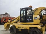 2020 Komatsu PW128US wheel excavator, side profile view