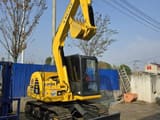 2024 Komatsu PC70 mini excavator, rear three-quarter view
