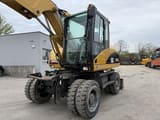 2006 Caterpillar M313C wheel excavator front three-quarter view