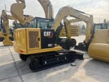 2026 Caterpillar 307 mini excavator, rear three-quarter view