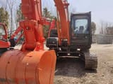 Hitachi ZX120 crawler excavator, front view