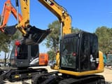 2025 Caterpillar 308E mini excavator, front three-quarter view